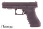 Picture of Used Glock 22 Gen 3, 40 S&W, Semi Auto Pistol, 3 Dot Tritium Night Sights,  Hogue Wrap Aroud Grip, 3 Magazines, Original Box, Very Good Condition