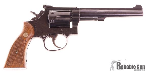 Picture of Used Used Smith & Wesson 17-4, 22 LR 6 Shot Revolver, Wood Grips, Gloss Blue, Good Condition Stamped B.C. AUX.