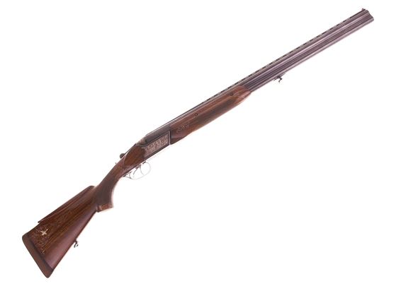 Picture of Used Baikal TOZ-34E Over Under Shotgun, Souvenir Grade, 12-Gauge 2-3/4'', 28'' Barrel Full + Full Choke, Double Trigger, Highly Engraved, Deer Scene on Left, Dog & Bird Scene on Right, Mother of Pearl Duck On Stock, Wire Inlay on Stock, Very Good Conditi