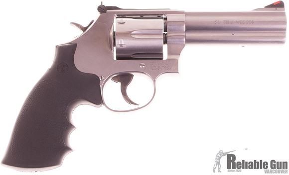 Picture of Used Smith & Wesson (S&W) Model 686-6 DA/SA Revolver - 357 Mag, 4-1/4", Satin Stainless Steel Frame & Cylinder, Medium Frame (L), Synthetic Grip, 6rds, Red Ramp Front & Adjustable White Outline Rear Sights. Like new condition w/Extra Woodgrips