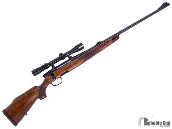 Picture of Used Steyr Mannlicher Model S Bolt Action Rifle, 7mm Rem Mag, 26'' Hammer Forged Barrel w/Sights, Double Set Trigger, Wood Stock, 1 Magazine, Redfield 3-9x40 Lo-Pro Scope, Crack on Trigger Guard, Good Condition
