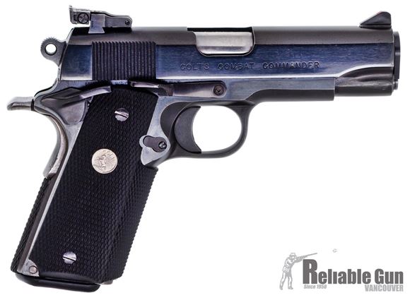 Picture of Used Colt 1911 Combat Commander Semi-Auto 45 ACP, 4.25", Blued, Ambi Slide Stop & Safety, Extended Mag Release & Magwell, Rubber Wraparound Grips, One Mag, Adjustable Sights, Good Condition