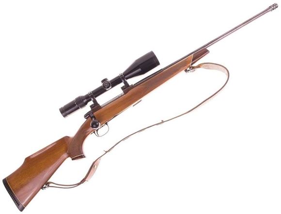 Picture of Used Tikka M65 Bolt Action Rifle, 300 Win Mag, 22'' Barrel With Muzzle Brake, Wood Stock, Oversize Bolt Handle, B. Nickel 3-12x56 Scope, Opti lock Mounts, Leather Sling, 1 Magazine, Good Condition