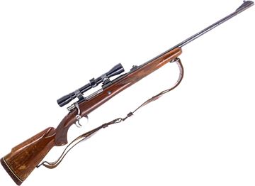 Picture of Used Browning FN Safari Bolt Action Rifle, 308 Norma Mag, 24'' Barrel w/Sights, Wood Stock, Browning 4x Scope Tipp Over Mount, Bluing Is Very Worn, Some Pitting, Stock is Scratched And Worn, Leather Sling, Poor Condition