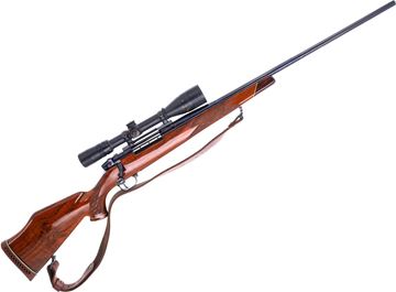 Picture of Used Weatherby Mark V Deluxe Bolt-Action Rifle, 300 Wby, 26" Barrel, Blued, Wood Stock, Bausch & Lomb 2.5-10x40 Riflescope, Leather Sling, Good Condition